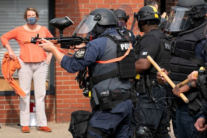 Police fire a pepper ball gun into a crowd during a protest after a decision in the case against police officers involved in the death of Breonna Taylor, who was shot dead by police in her apartment, in Louisville, Ky., Sept. 23, 2020. (Reuters Photo)